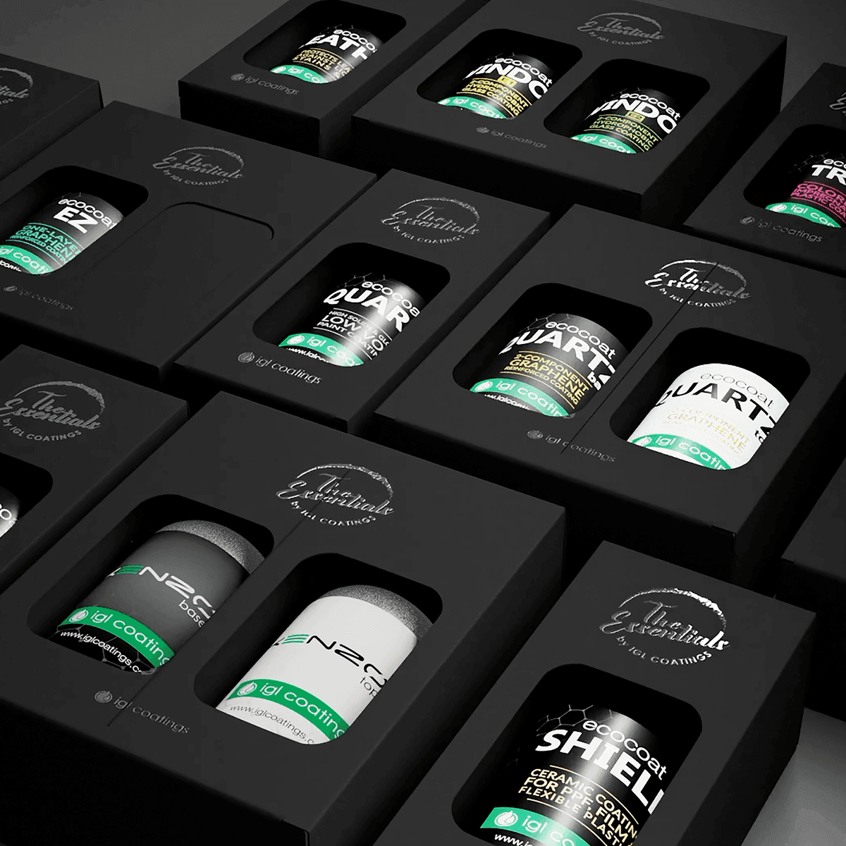 Assorted black packaging boxes showcasing car care products with visible labels and logos.